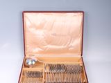 a box with silverware in it on a table