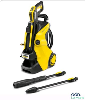 a yellow pressurer with a black hose and a hammer