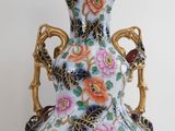a vase that is sitting on a white table