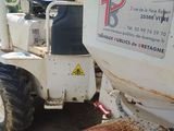 a tractor that is parked on the side of the road