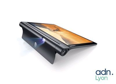 a close up of a tablet with a projector on top of it