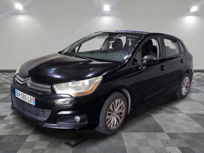 a picture of a black car parked in a garage