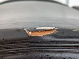 a close up of a piece of leather with a hole in it