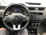 steering view of a car with a person sitting in the driver ' s seat in the driver ' s seat