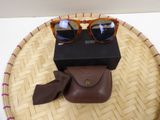 a pair of sunglasses sitting on top of a basket