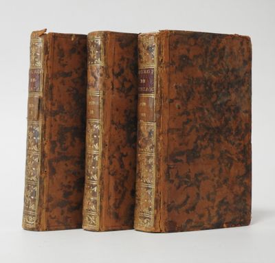 a pair of old books sitting on top of each other