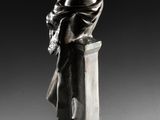 an image of a statue of a man sitting on top of a pedestal