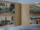an open book with pictures of buildings and a clock on it