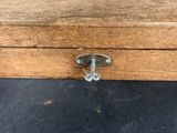 a close up of a wooden box with a latch