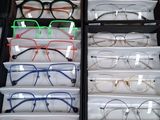 many pairs of glasses sitting in a drawer