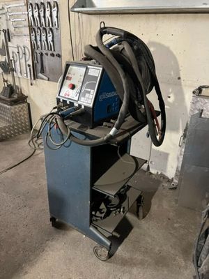 a machine that is sitting on a cart in a garage