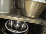 two bowls and a bowl on the shelf in the kitchen