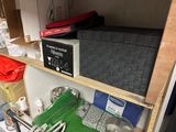 a kitchen cabinet with a lot of utensils and other items on it