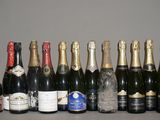 a lot of bottles of champagne on the table