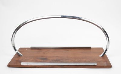 an image of a metal and wood handle on a wooden stand
