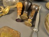 a table that has a lot of silver and gold items on it