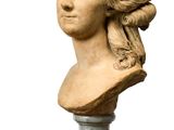 marble bust of a woman with long hair on a marble base