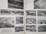 an open book with pictures of various buildings in it