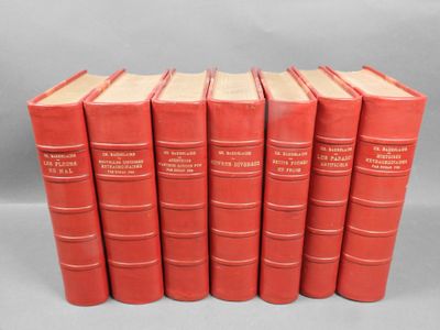 a set of six red leather books on a grey background