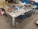 a table with a lot of tools on it in a garage