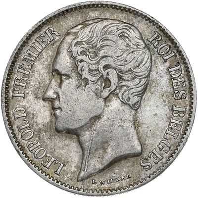 a close up of a coin with a woman ' s head on it
