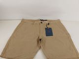 men ' s khaki shorts with a tag on the side