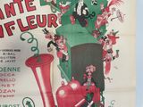 a poster for a musical show with a man on a train