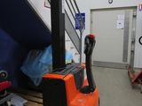 a forklift that is sitting in a warehouse
