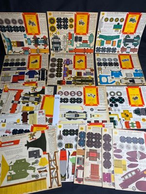many different types of paper toys on the table