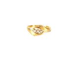 a close up of a gold ring on a white background