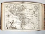 an old book with a map of the americas on it