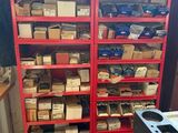 a red shelving filled with lots of different types of tools