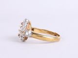 an image of a gold ring with three diamonds on it