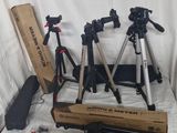 many different types of tripods on a table