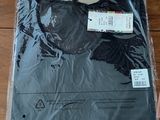 a package of clothing sitting on a table next to a pair of scissors