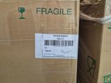 a box of fragile wine sitting on the floor
