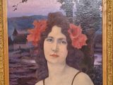 painting of a woman with flowers in her hair in a gold frame