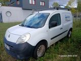 a white van that is parked in the grass