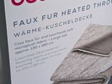 packaging of a box of heated towels on a shelf in a store