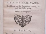 un vieux livre sur lequel figure l'image en noir et blanc d'un oiseau
