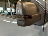 a close up of a car ' s side view mirror with a ruler on it