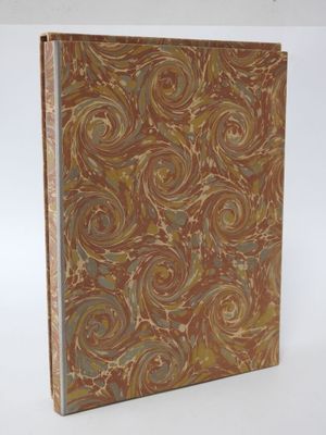 a brown and blue book with swirl designs on it