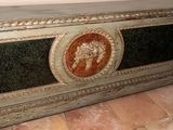 an image of a very old looking console with a painting on it