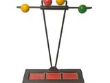 an image of a sculpture of three balls on a stand