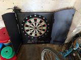a dart board with a dart in the middle of it