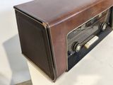 a brown radio sitting on top of a white table