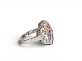 a close up of a ring on a white surface