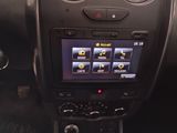 the dashboard of a car with a digital display in the center of it