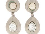 a pair of earrings with a white stone and a pearl