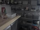 a small kitchen with a lot of items on the counter